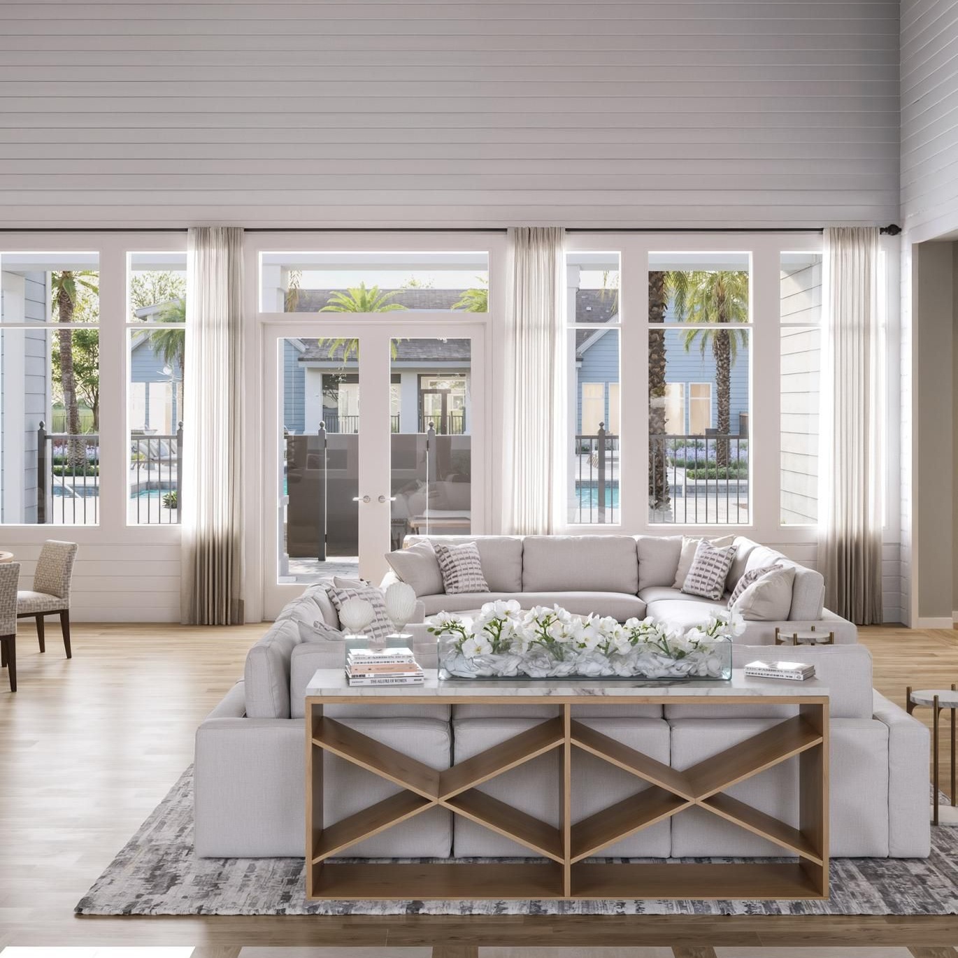a living room with a large glass door and a large window