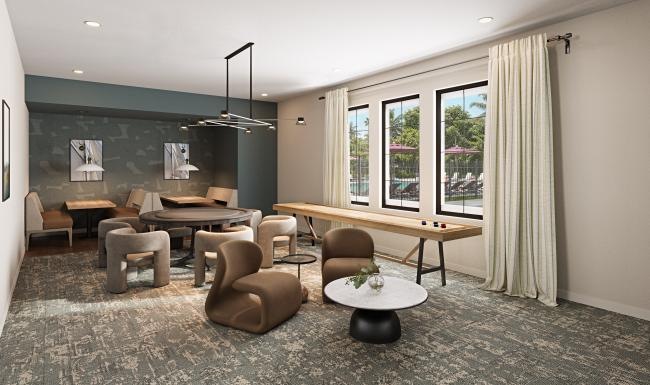 a game room with tables and chairs