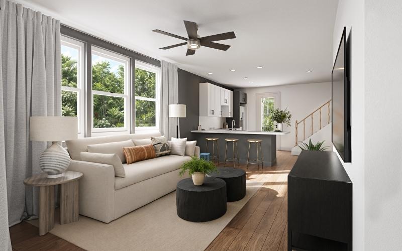 a living room with a white couch and a table