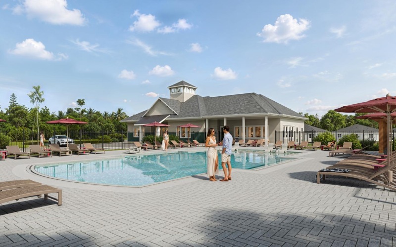 a couple standing by a pool